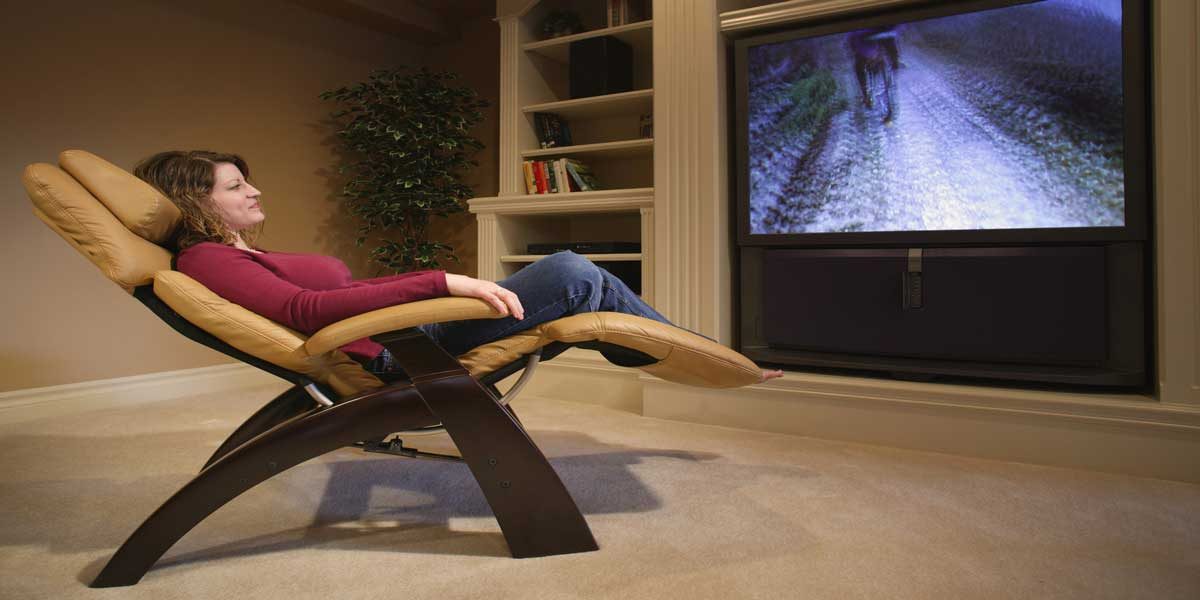 Image Commercially Licensed from https://depositphotos.com/photo/woman-relaxes-in-front-of-television-31950827.html