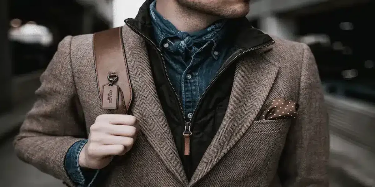 Image commercially licensed from https://unsplash.com/photos/man-in-brown-suit-jacket-carrying-brown-backpack-HqtYwlY9dxs