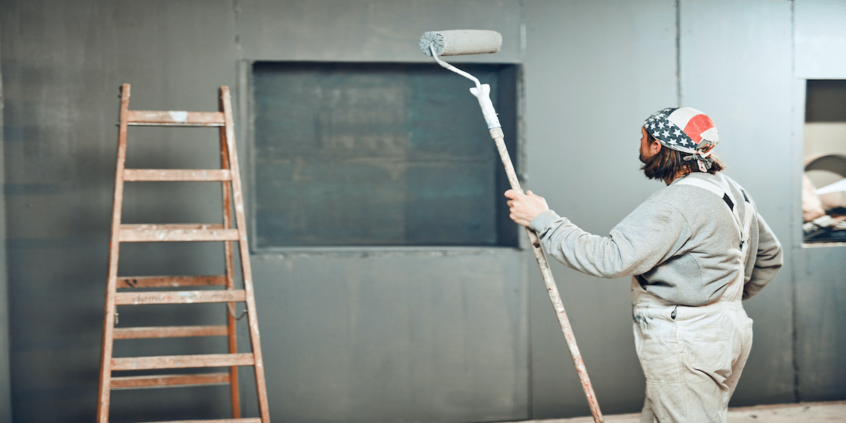 Image commercially licensed from https://unsplash.com/photos/painter-painting-walls-with-a-extender-roller-indoors-lXrzgCiPQhk