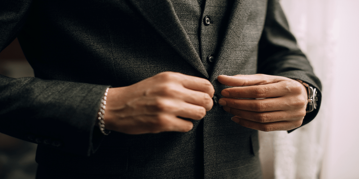 Image commercially licensed from https://unsplash.com/photos/a-man-in-a-suit-adjusting-his-watch-tEP8Hm6-y8o