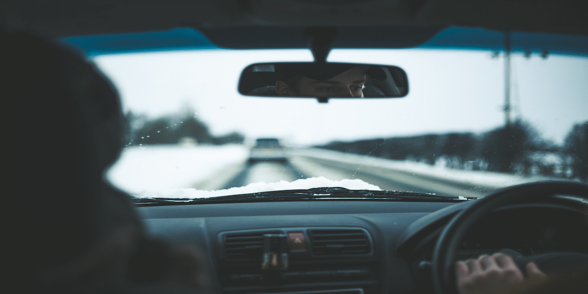 Image commercially licensed from https://unsplash.com/photos/man-inside-car-near-trees-at-daytime-yg7uvjnwMcc